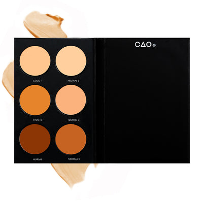 Black Matte rectangular cardboard palette with 6 circular openings for “Advanced Foundation” refill cream product in shades Cool 1, Neutral 2, Cool 3, Neutral 4, Warm 6, and Neutral 5, on top of creamy swatch.