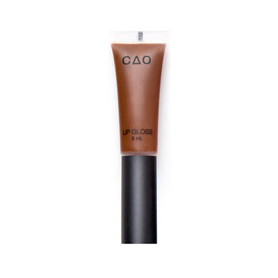 Clear squeeze out lipgloss tube with black matte top filled with lipgloss product in the shade "Cocoa"