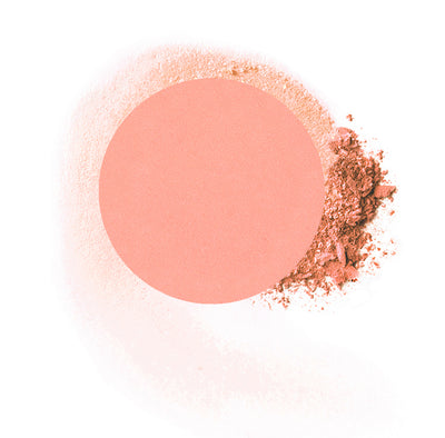 Round compressed  powder blush refill shade in "Just Peachy" on top of loose powder swatch.