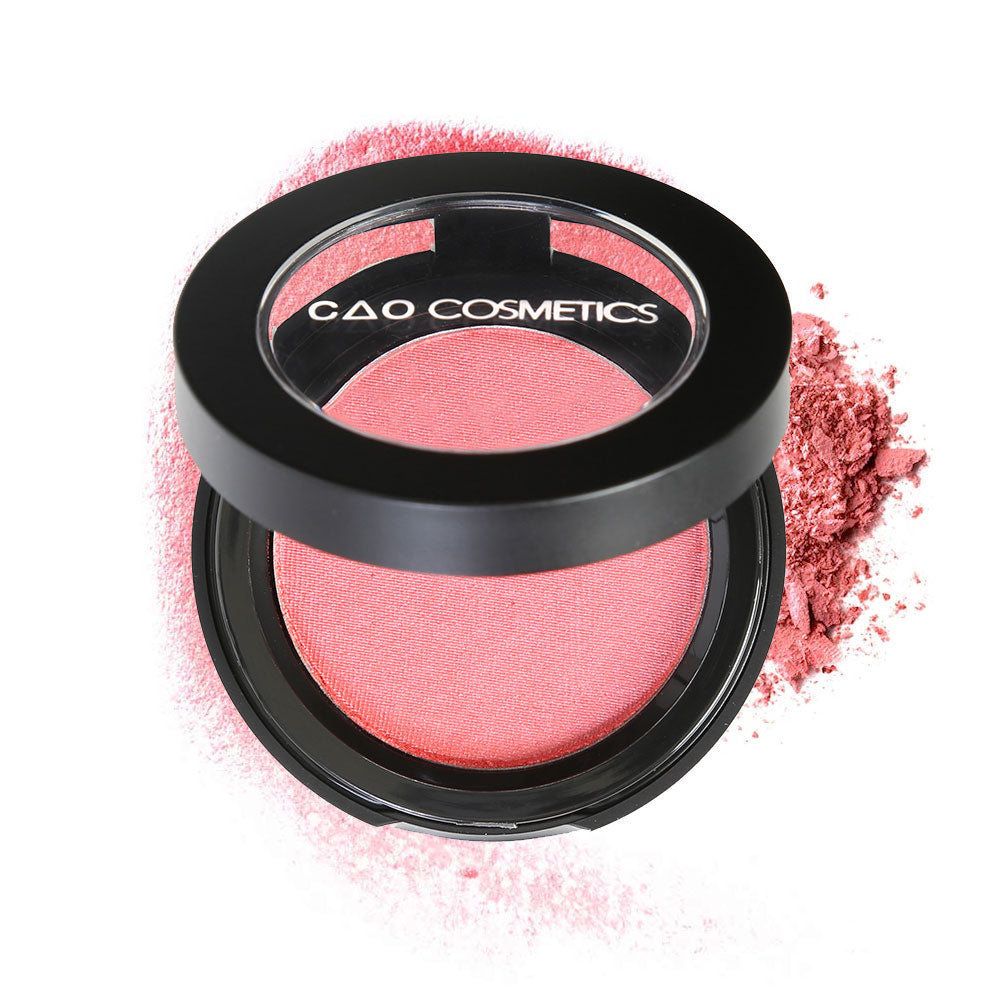 Round Matte Black Component, clear round top window, filled with compressed round powder blush shade in "American Beauty" on top of loose powder swatch.