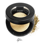 Semi- open eyeshadow compact with light shimmer gold eyeshadow in shade "glam" compressed powder and on white background with loose eyeshadow powder on white..