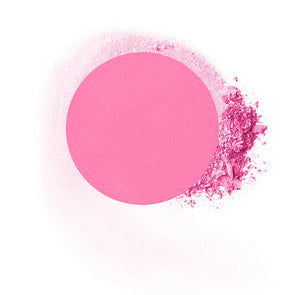 Round compressed  powder blush refill shade in "Foxy" on top of loose powder swatch.