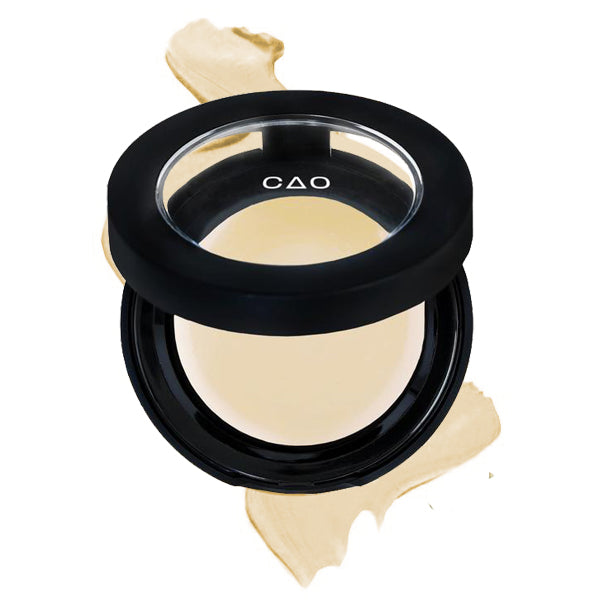 Round Matte Black Component, clear round top window, filled with round creamy concealer shade in "Ultra Lite" on top of creamy swatch.