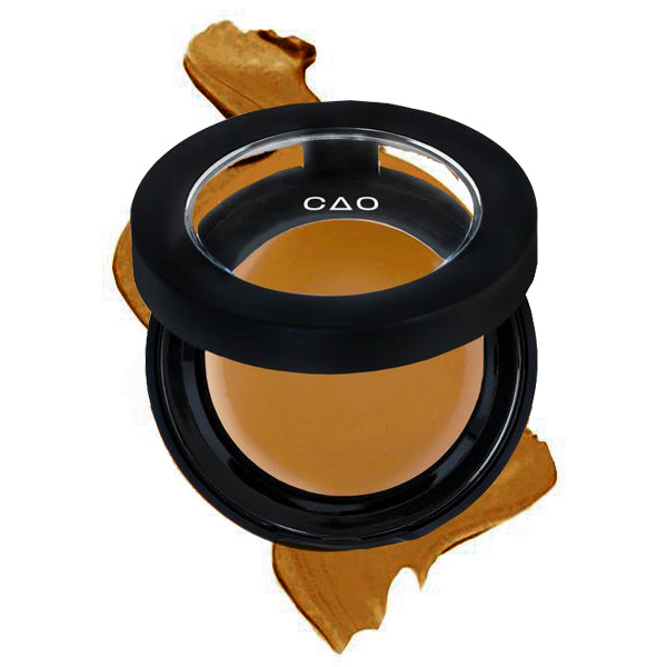 Round Matte Black Component, clear round top window, filled with round creamy concealer shade in "Medium" on top of creamy swatch.