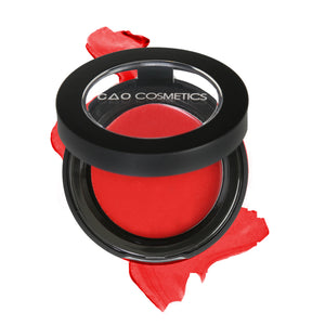 Round Matte Black Component, clear round top window, filled with round creamy dual lip and cheek product shade in "Rapture" on top of creamy swatch.